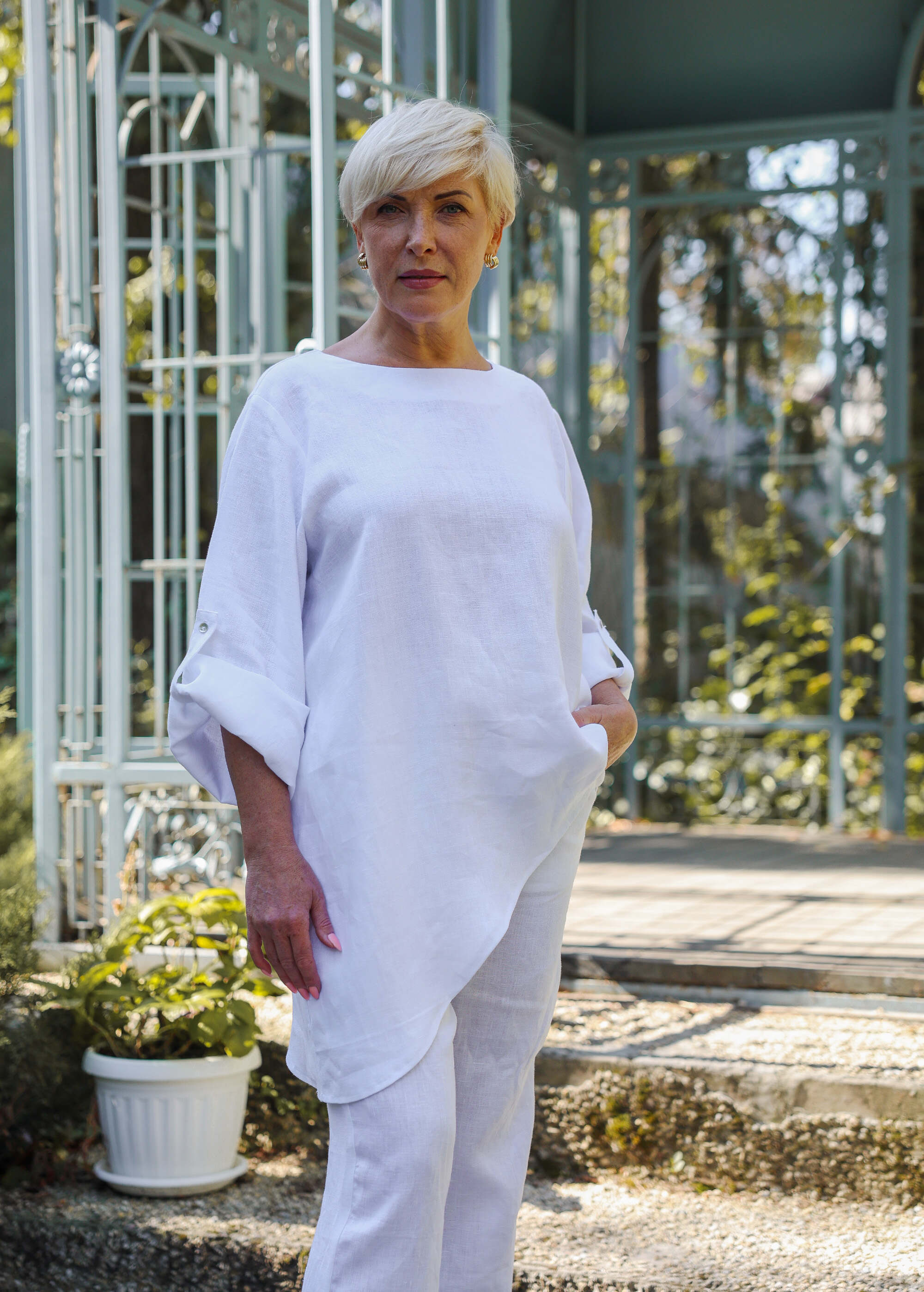 a woman standing in front of a building