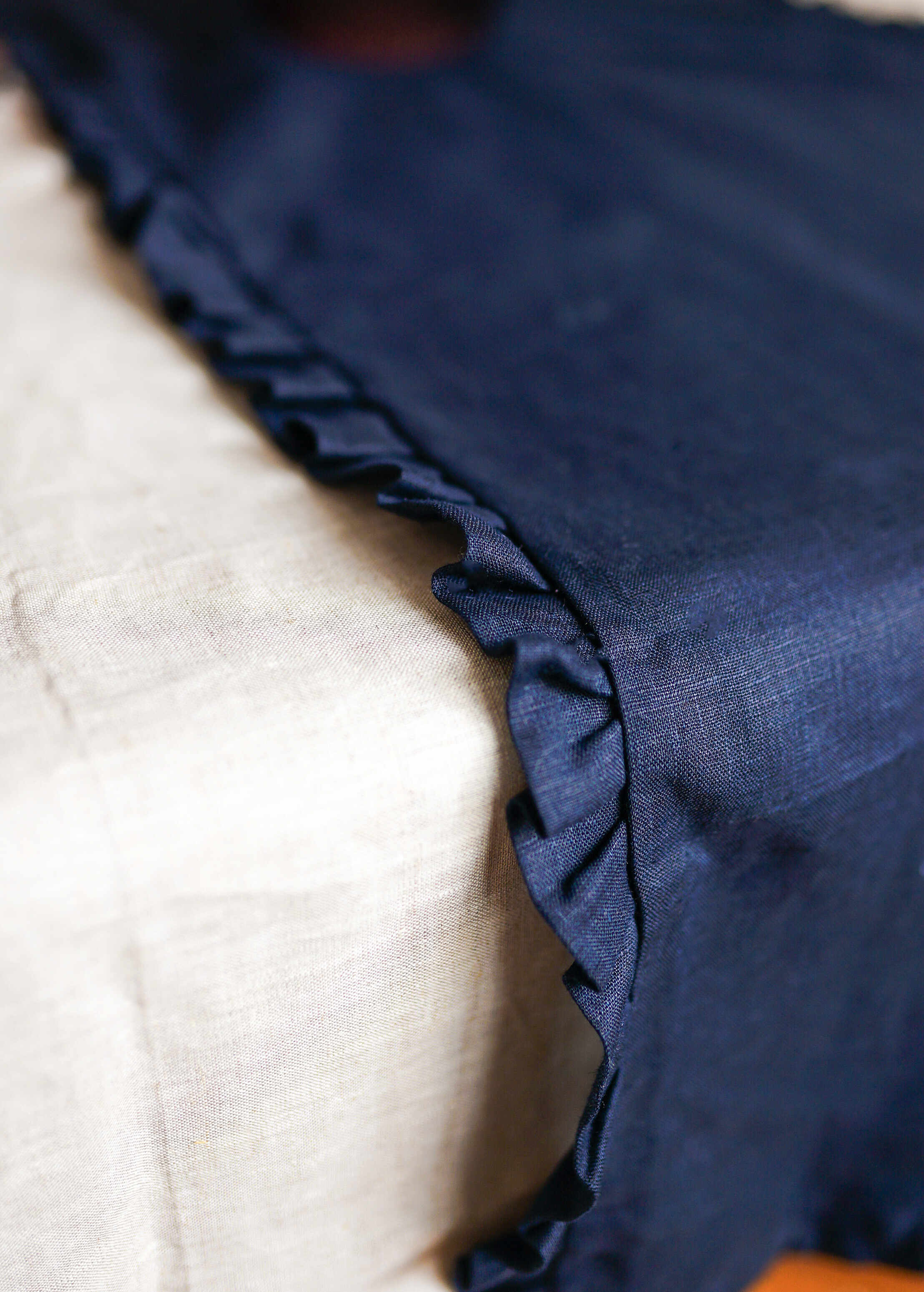 a close up of a bed with a blue blanket