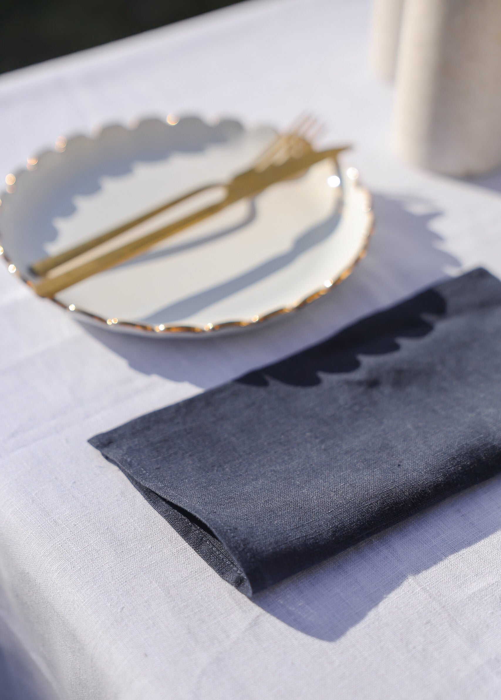 a table with a plate and a napkin on it