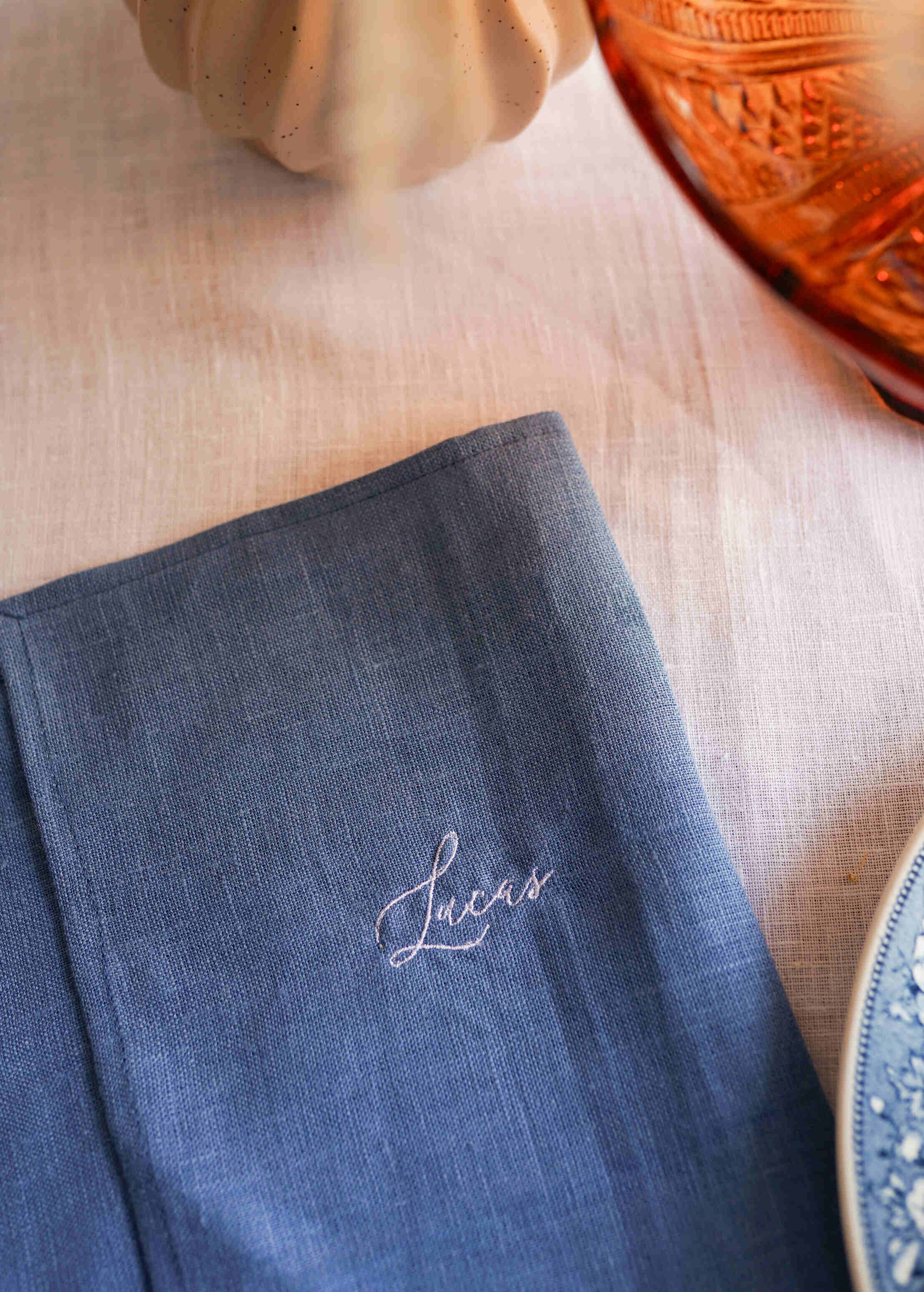 a table topped with a plate and a napkin