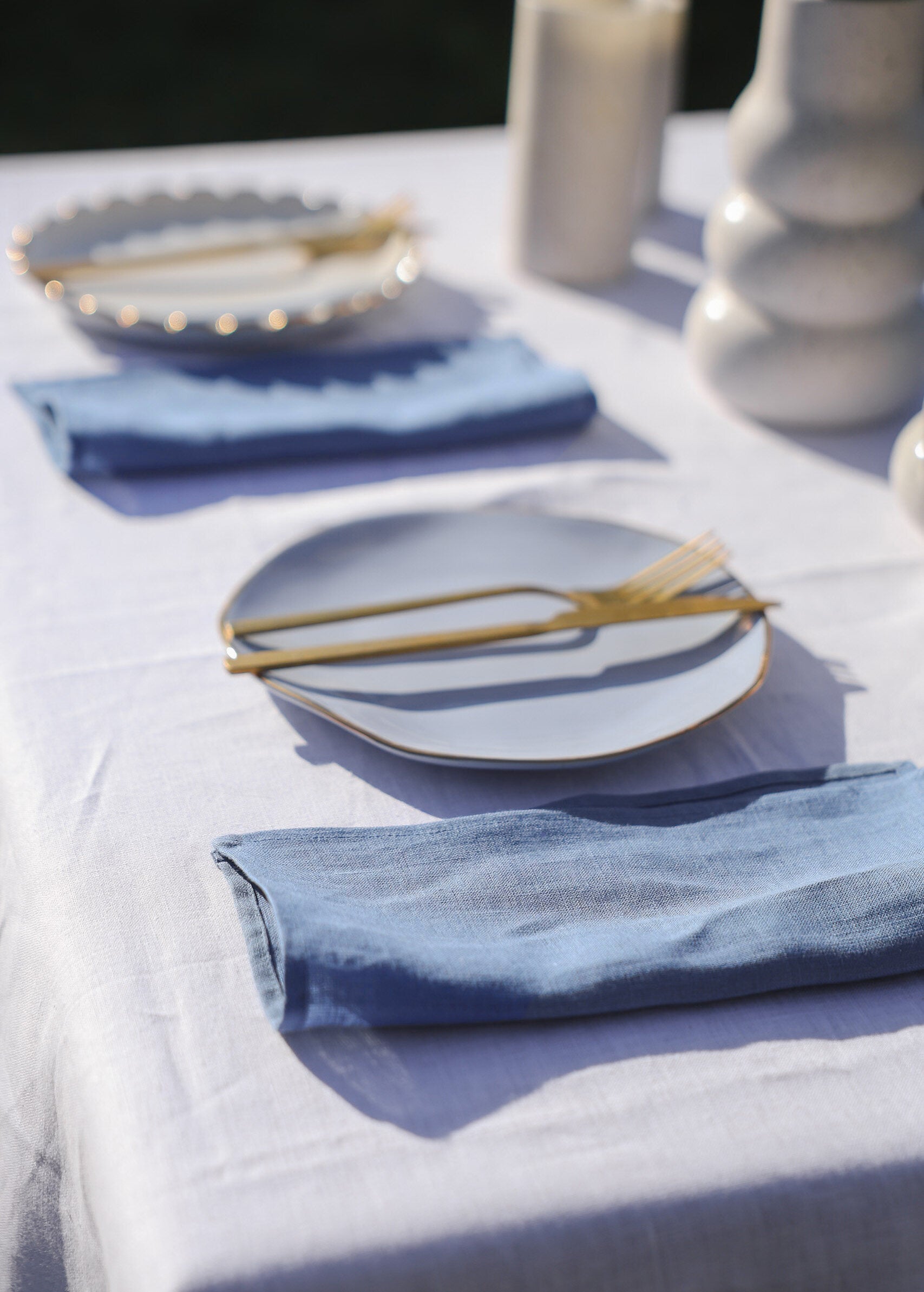 a table with plates and napkins on it