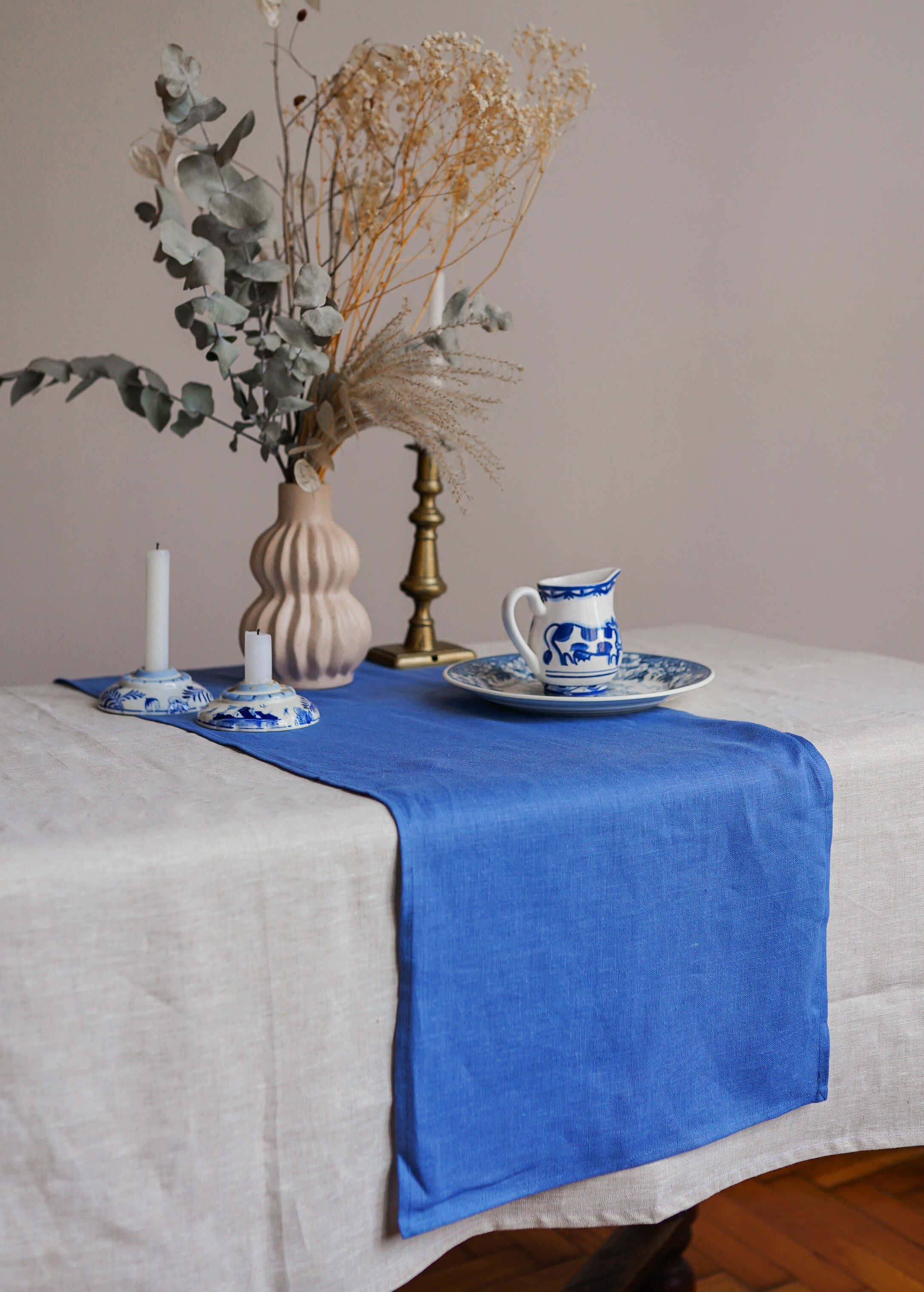 a table with a blue and white table runner