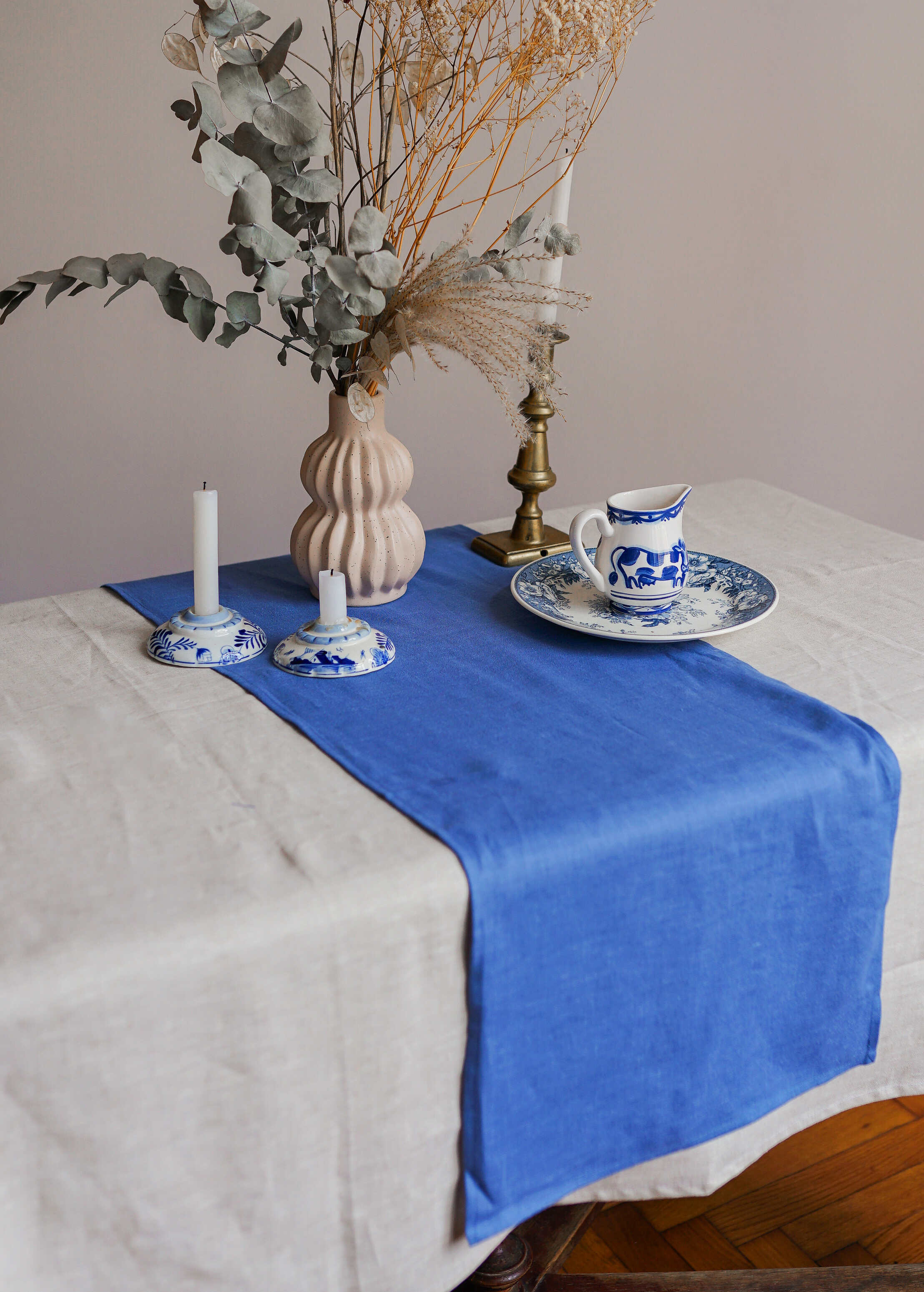 a table with a blue and white table runner