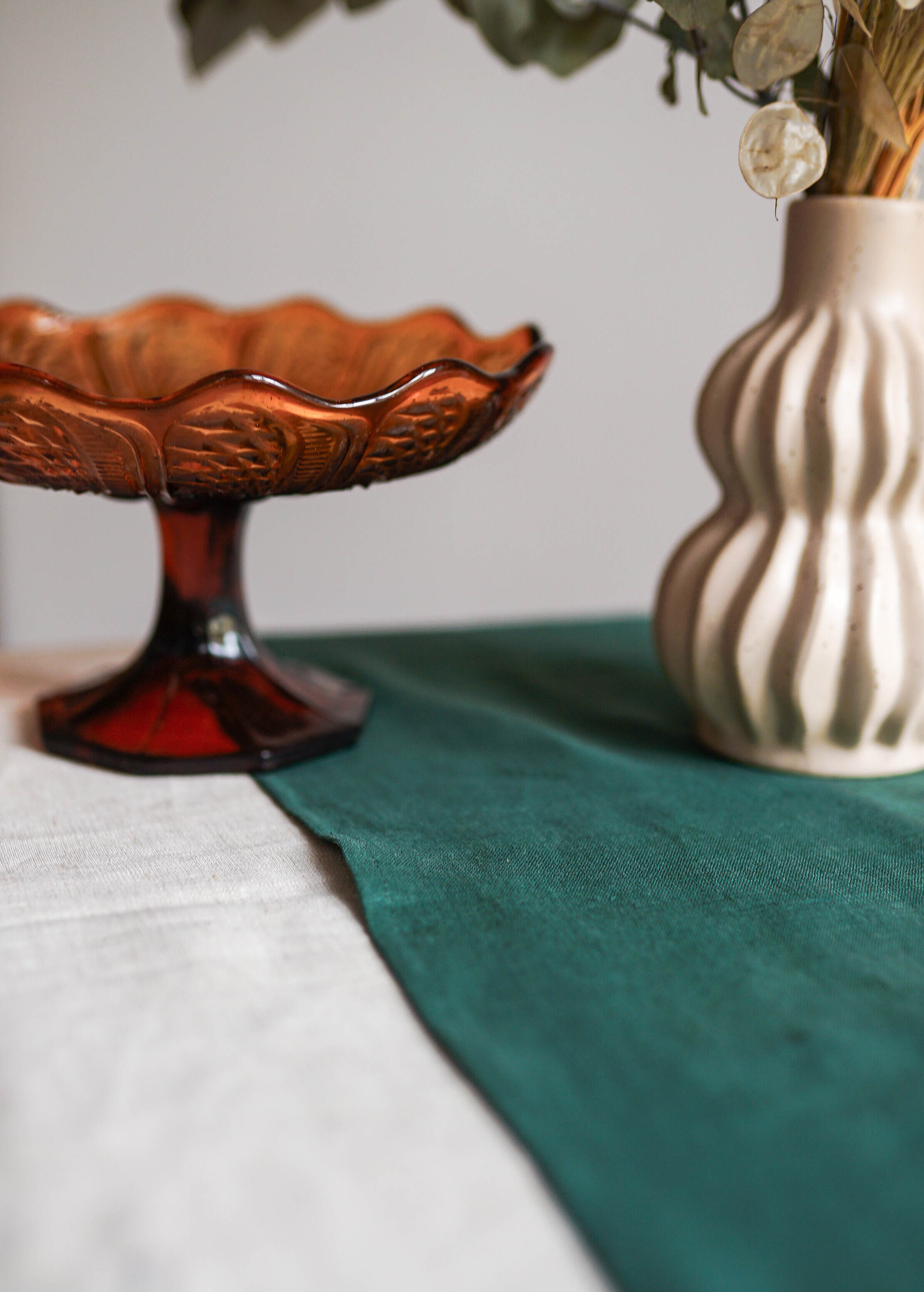 a vase with flowers in it sitting on a table