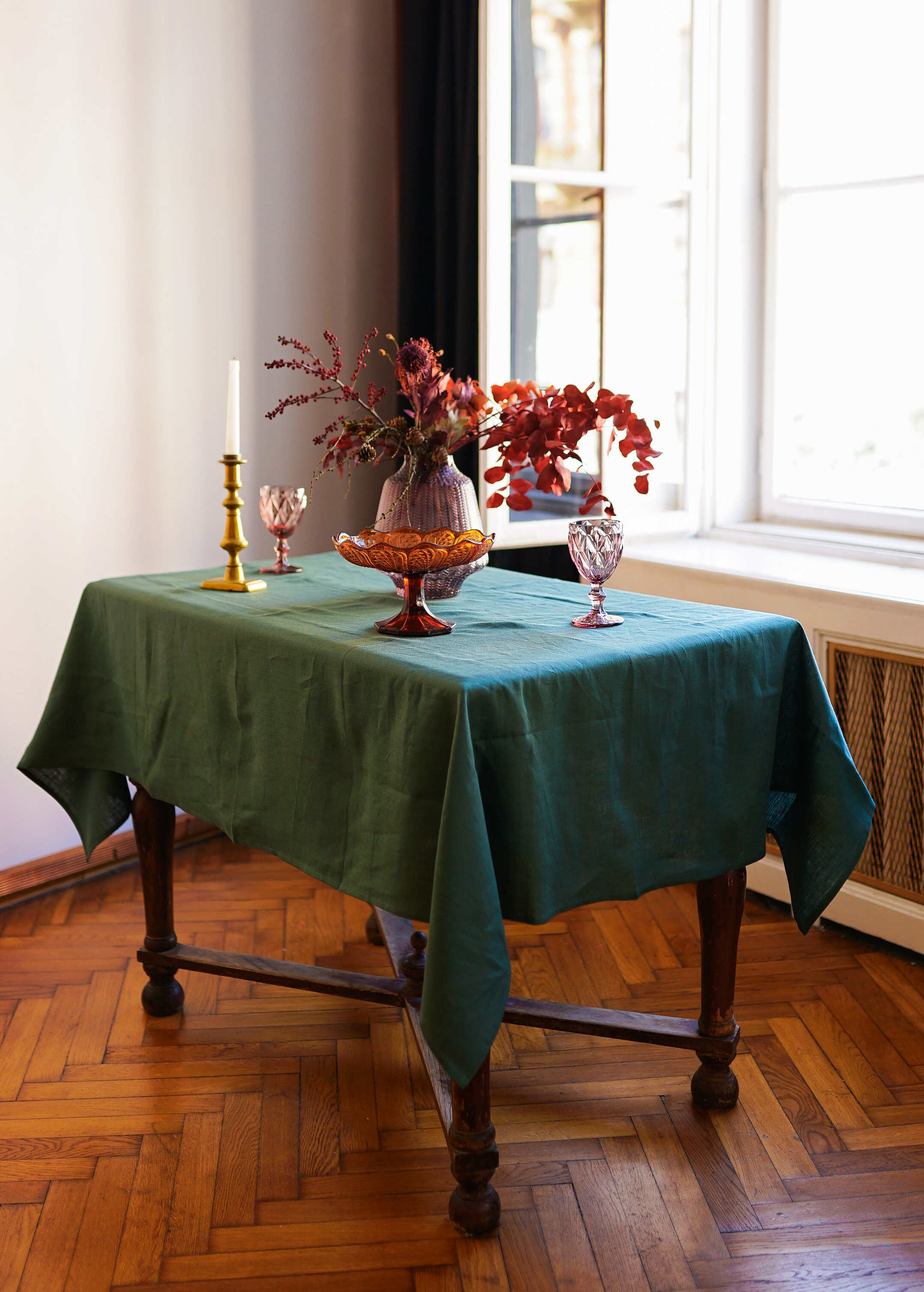 a table with a green table cloth on it