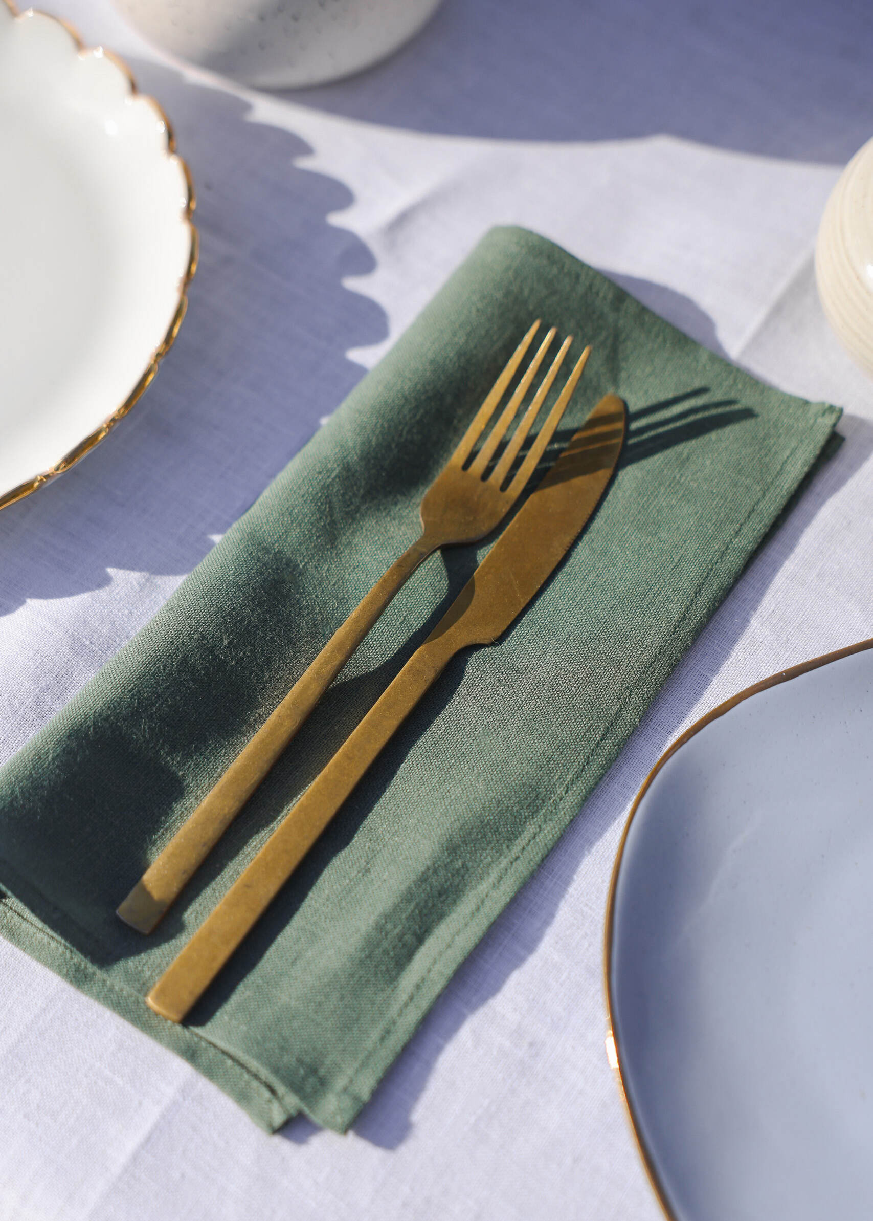 a fork and knife on a napkin on a table