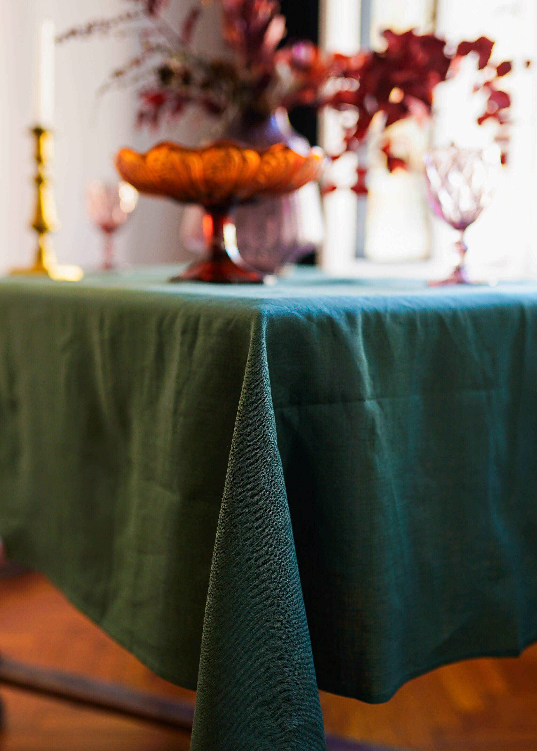 a table with a green table cloth on it