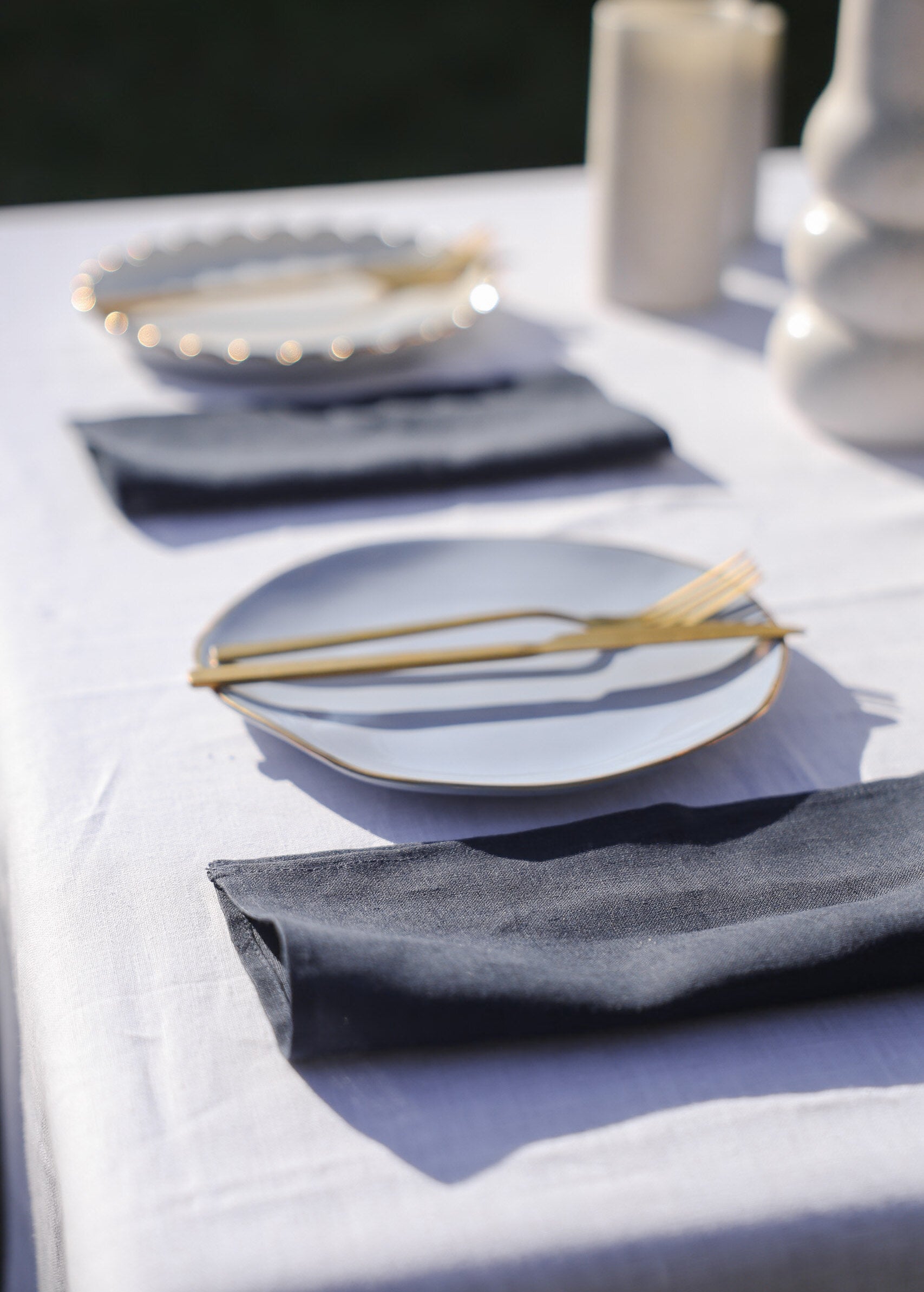 a table set with plates and silverware