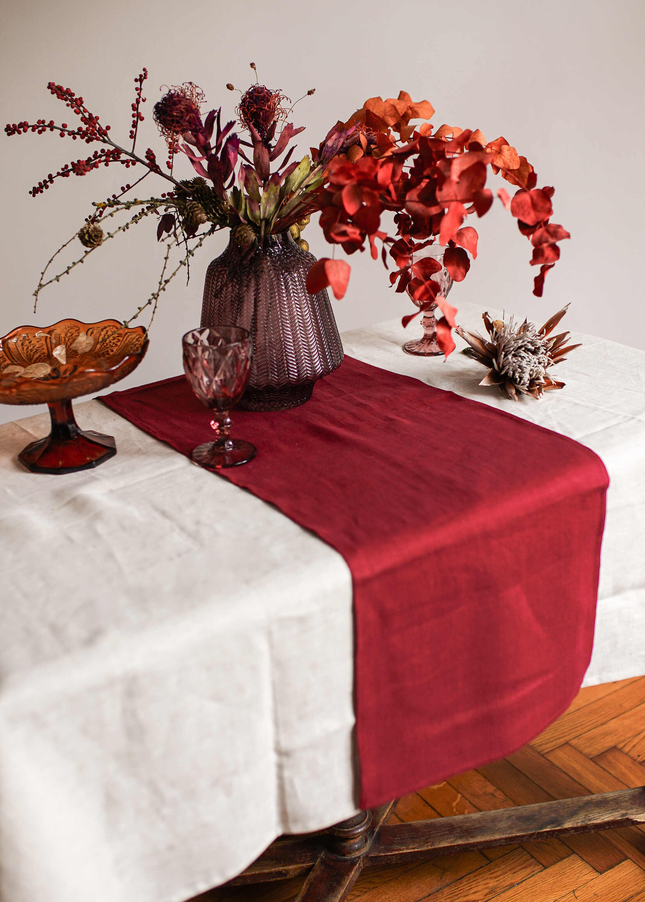 a table topped with a vase filled with flowers