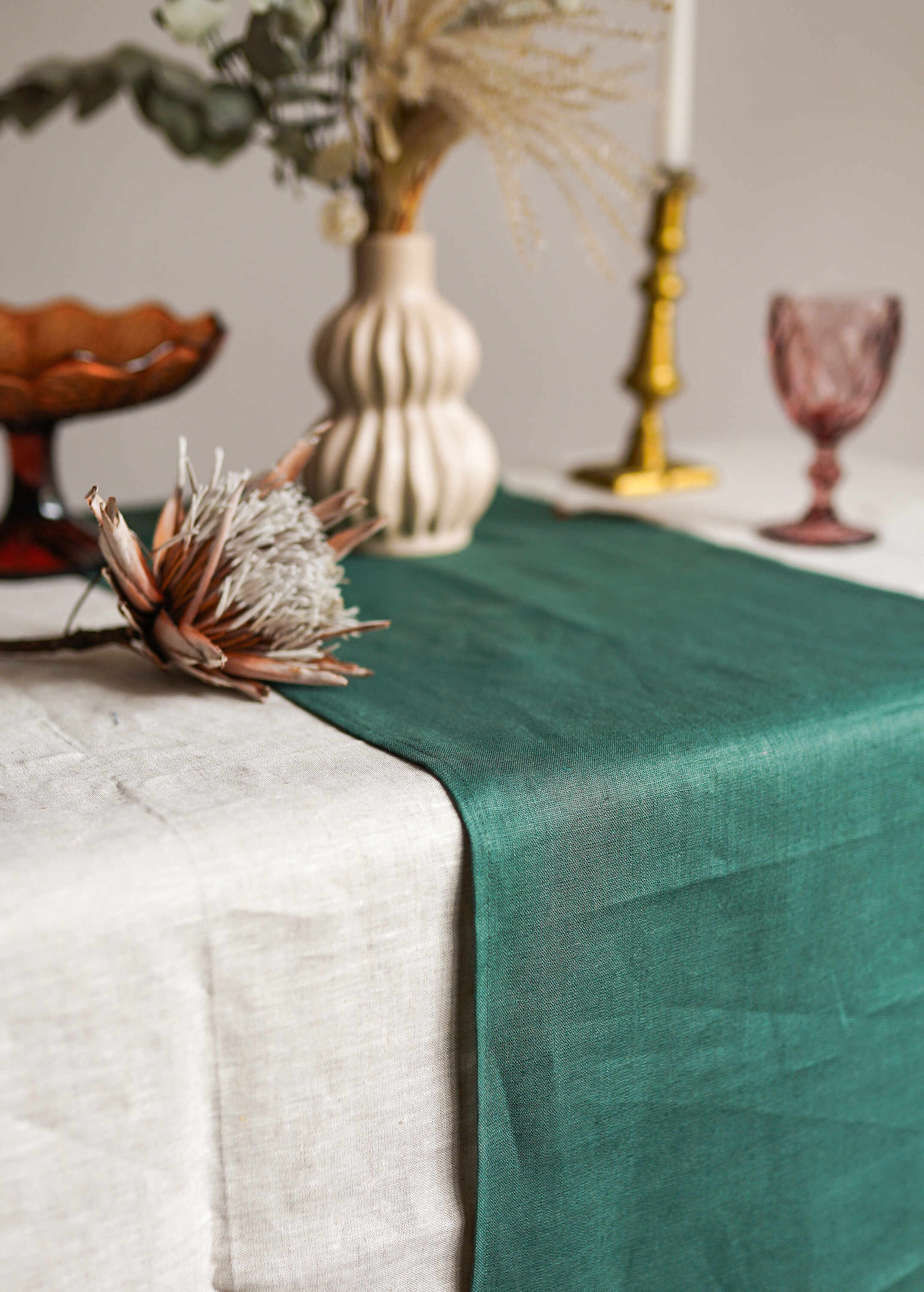 a table topped with a green table runner